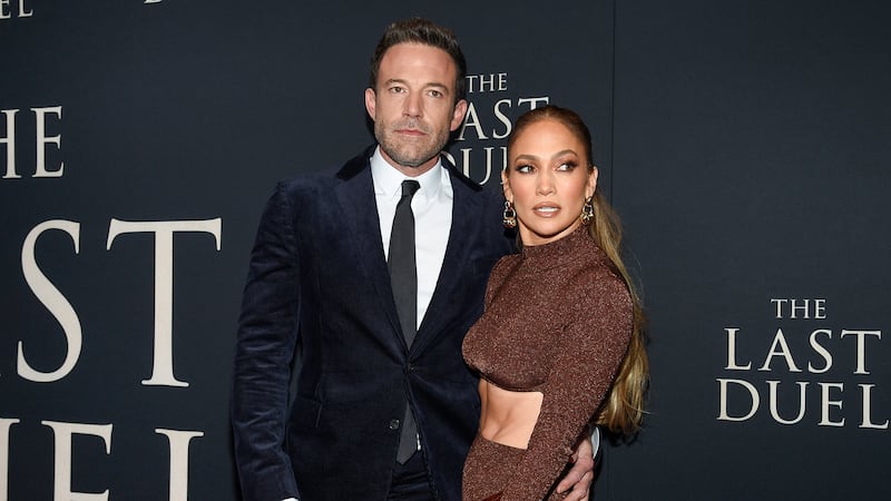 FILE - Actor Ben Affleck, left, and actor-singer Jennifer Lopez attend the premiere of "The...