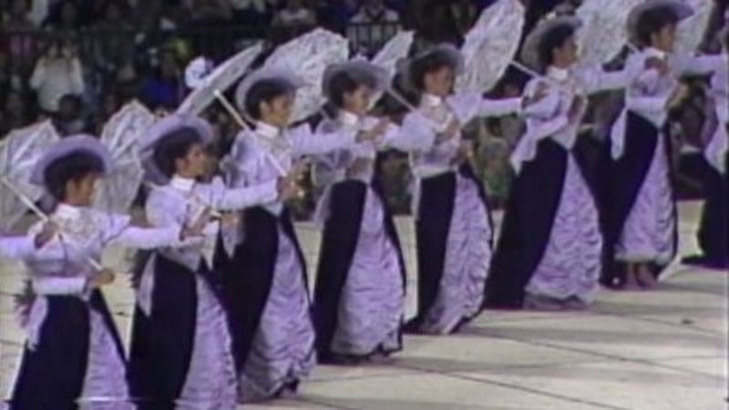 Hula dancers in elaborate ensembles take the stage in 'Auana Night at Merrie Monarch 1983.