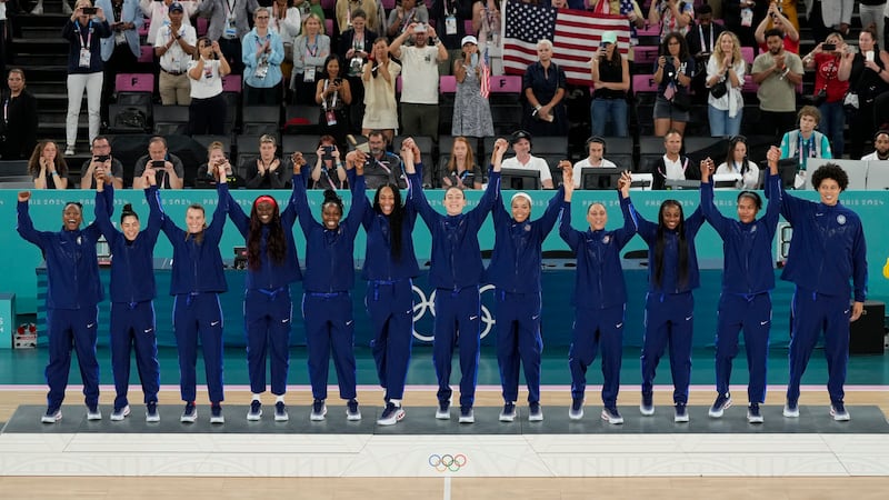 The United States team celebrates their gold medal win at Bercy Arena at the 2024 Summer...