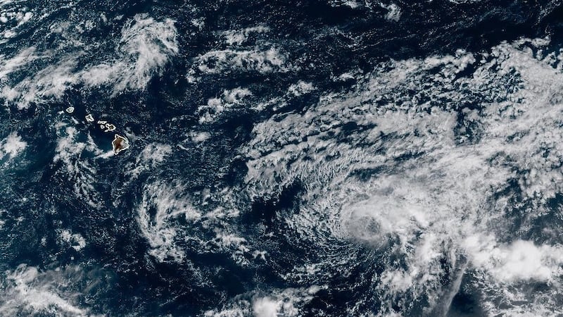 Tropical Depression Twelve-E is seen as a swirl of clouds to the east of Hawaii.