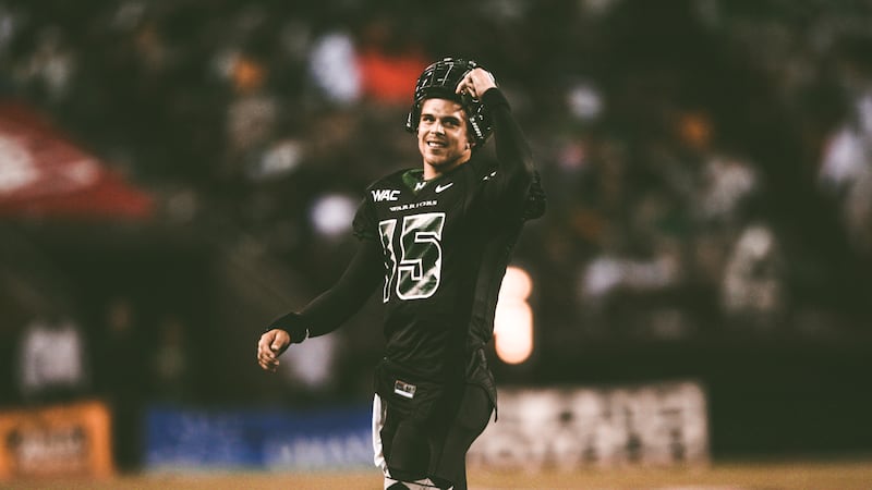 Colt Brennan removes his helmet during a University of Hawaii game at Aloha Stadium.