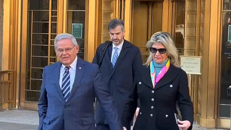 FILE - New Jersey Sen. Bob Menendez is shown with his wife outside a courthouse. His last day...