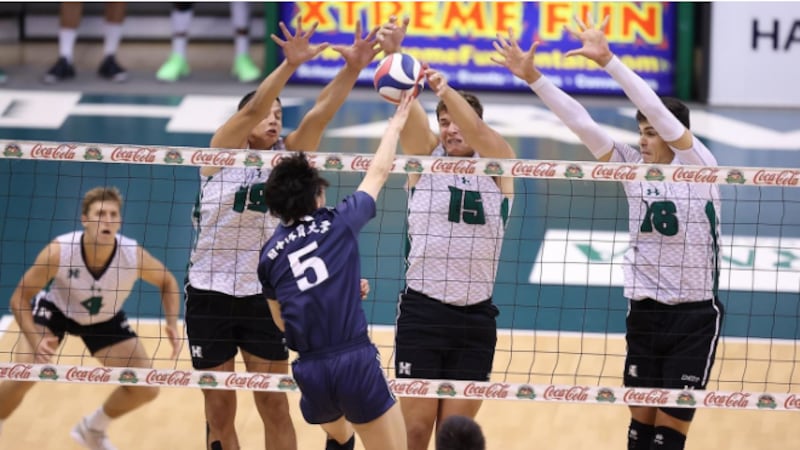 'Bows combine at the net for block in four set win over Japan's Nittaidai University.